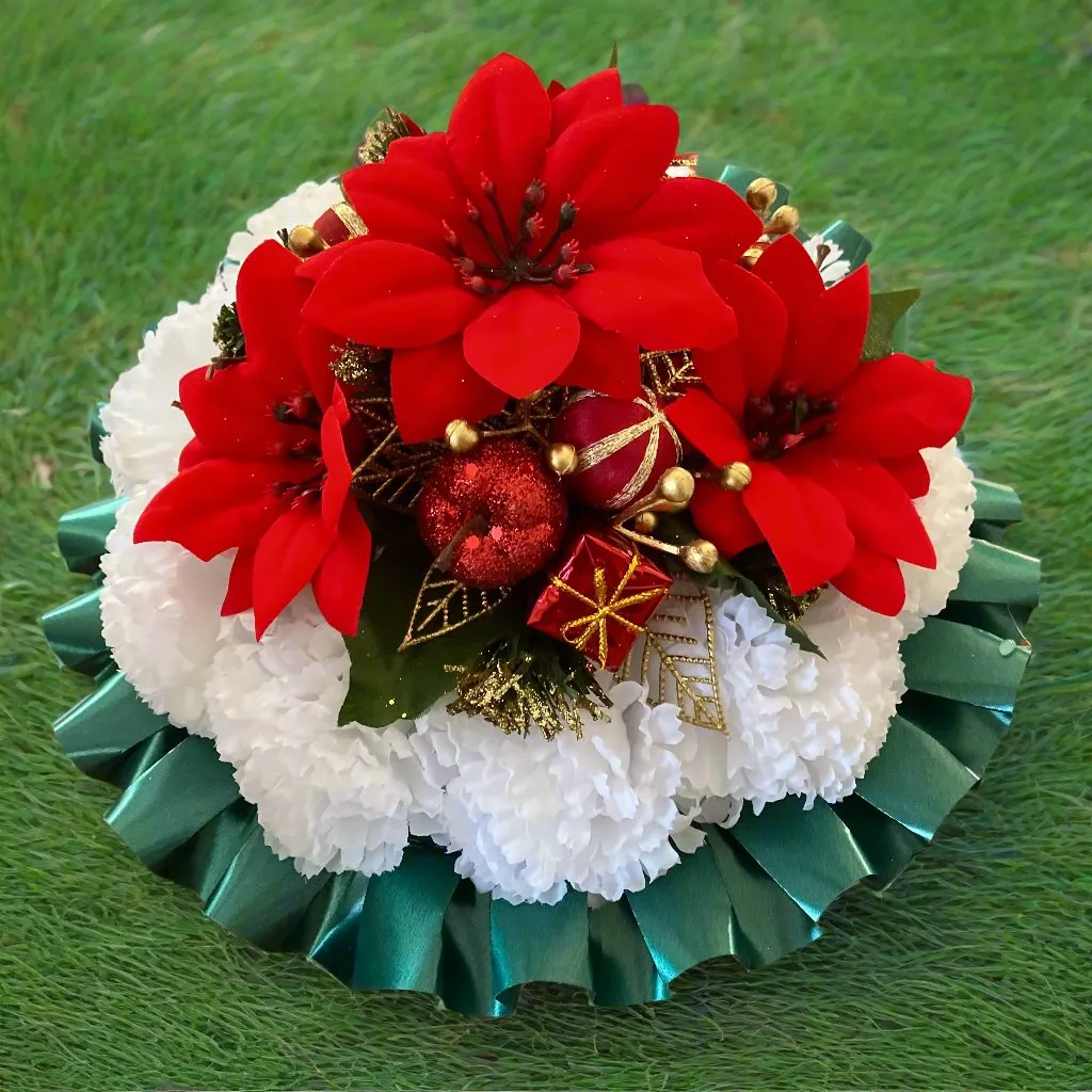 a memorial Christmas grave side posy of red poinsettia & baubles