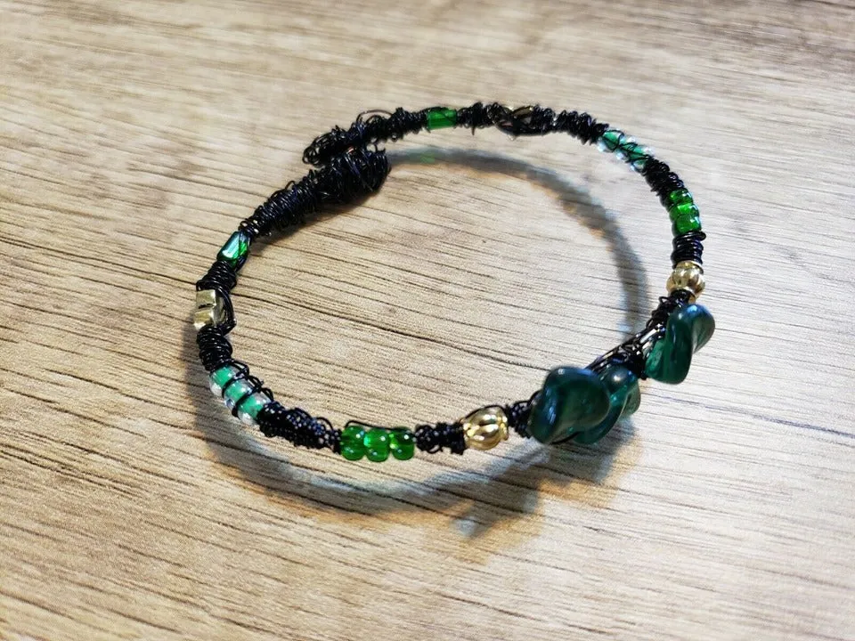 Hand Crafted Black Memory Wire Wrapped Bracelet, with Green Czech Glass and Gold Tone Metal Beads